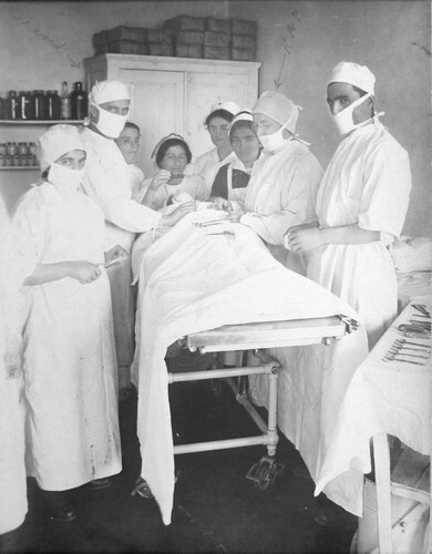 Dr. Ward and Dr. Parmelee operate on a patient. Harpoot, c. 1919-1922.