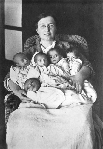 Dr. Parmelee holds five infants for the camera. Harpoot, c. 1919-1922.