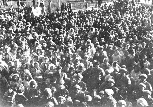 Several hundred orphans sit massed in the open. Harpoot, c. 1919-1922.