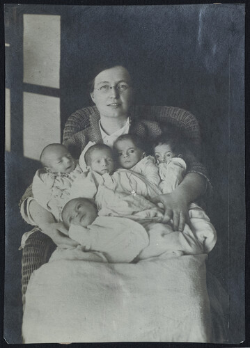 Ruth Parmelee with five infants. c. 1922-25