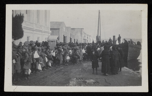 Orphans with kit sacks on a quay, c. 1922–1923