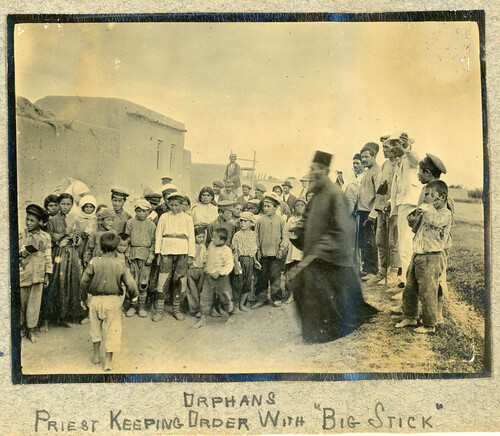 Home Orphan Dept: Orphans with priest keeping order