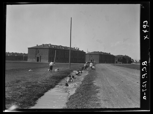Boys swim in an irrigation ditch by the barracks. Alexandropol, c. 1923–1925.