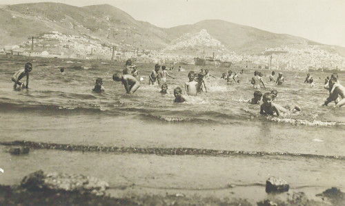 Orphanage children swimming off the shore at Syra, 1927