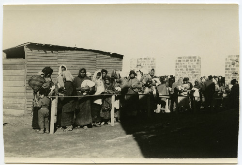 Women and children line up toward a relief shed, Beirut, c. 1921–1923, many 