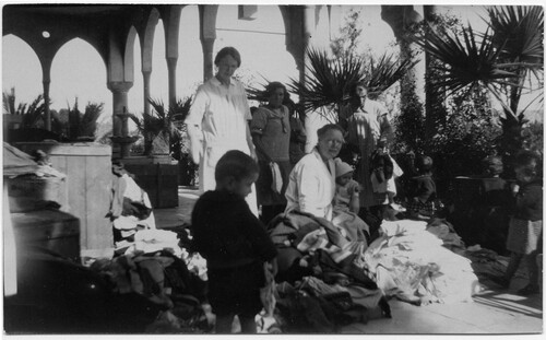 Maria Jacobsen (right) unpacking supplies sent from Denmark at the Birds' Nest Orphanage in Sidon, c. 1922. 