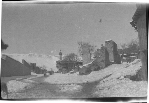 Marash under snow with damaged buildings