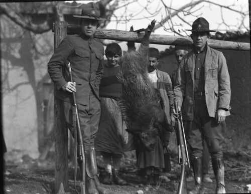 NER workers with rifles and hunted animal, Marash