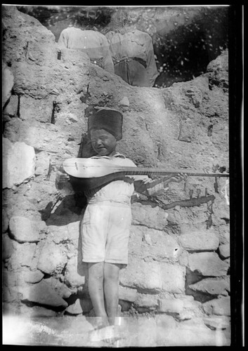 A small boy playing a saz, Near East Relief boys’ orphanage, Marsovan (Merzifon).