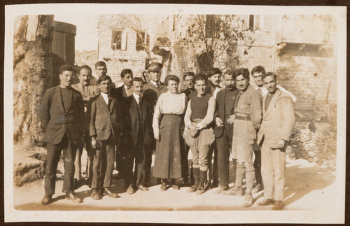 The Gannaways stand with the orphanage teachers. Jibail, 1922.