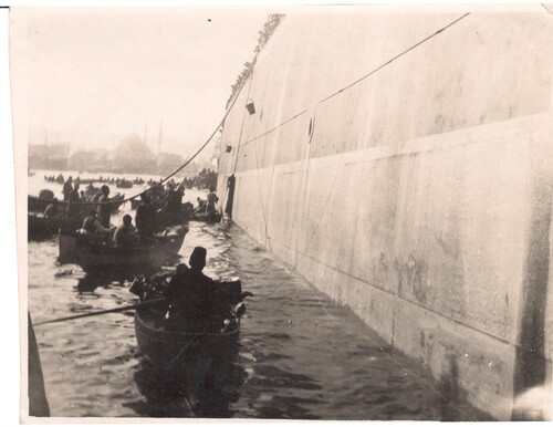 Boats load 5,500 refugees onto the transport. Stamboul, 1923.