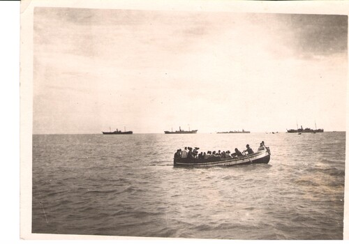 Boats ferry orphans out to the transports. Samsoun, December 1922.